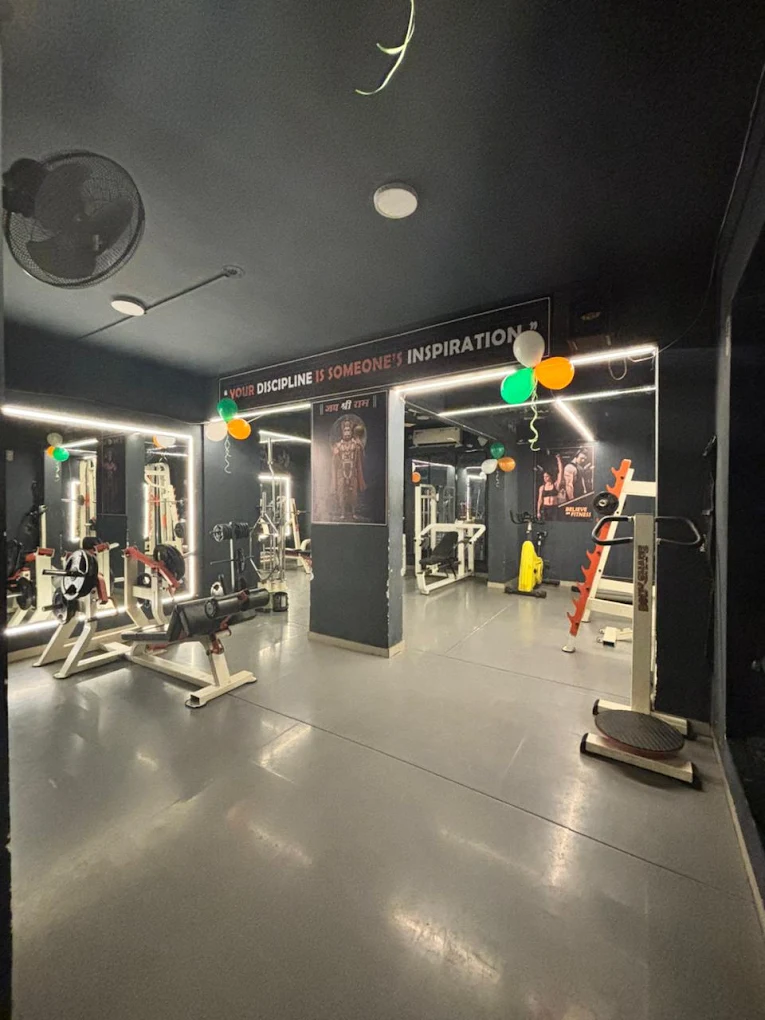 Iron Beast Unisex Gym floor with mirrors and strength equipment