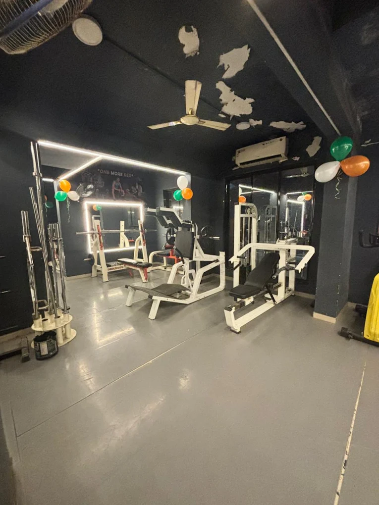 Recovery-friendly gym area with machines and open floor